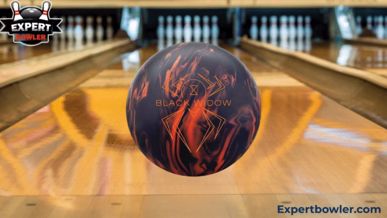Hammer Black Widow 3.0 bowling ball on lane with pins in background, featuring marble red and black color, spider logo and Expert Bowler branding for product review article