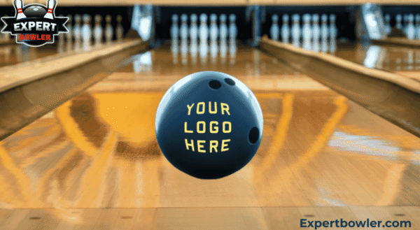 Personalized bowling ball displaying 'Your Logo Here' on a bowling lane, set against a blurred alley background, featuring the ExpertBowler logo.